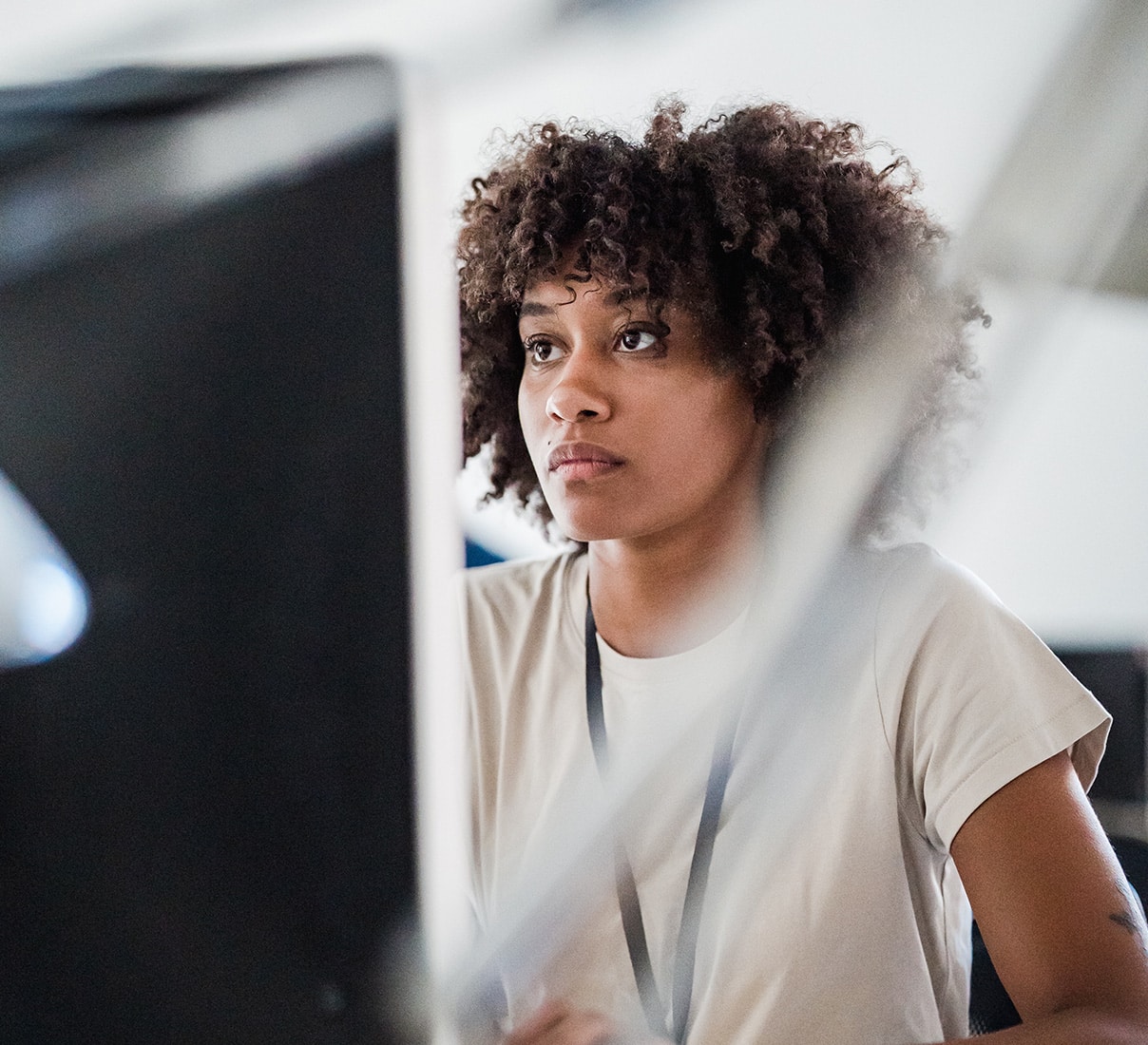 A woman looking at her computer screen