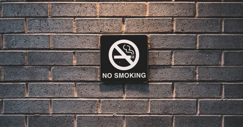 No smoking sign on brick wall