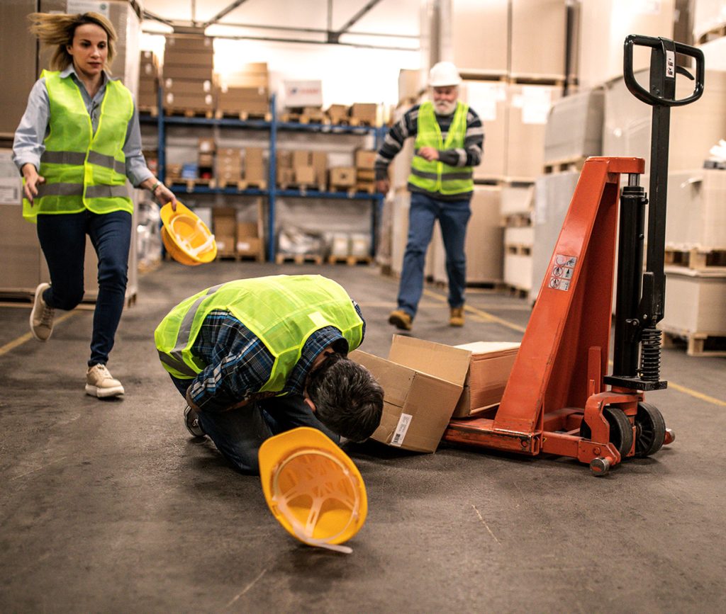 Injured worker on warehouse floor