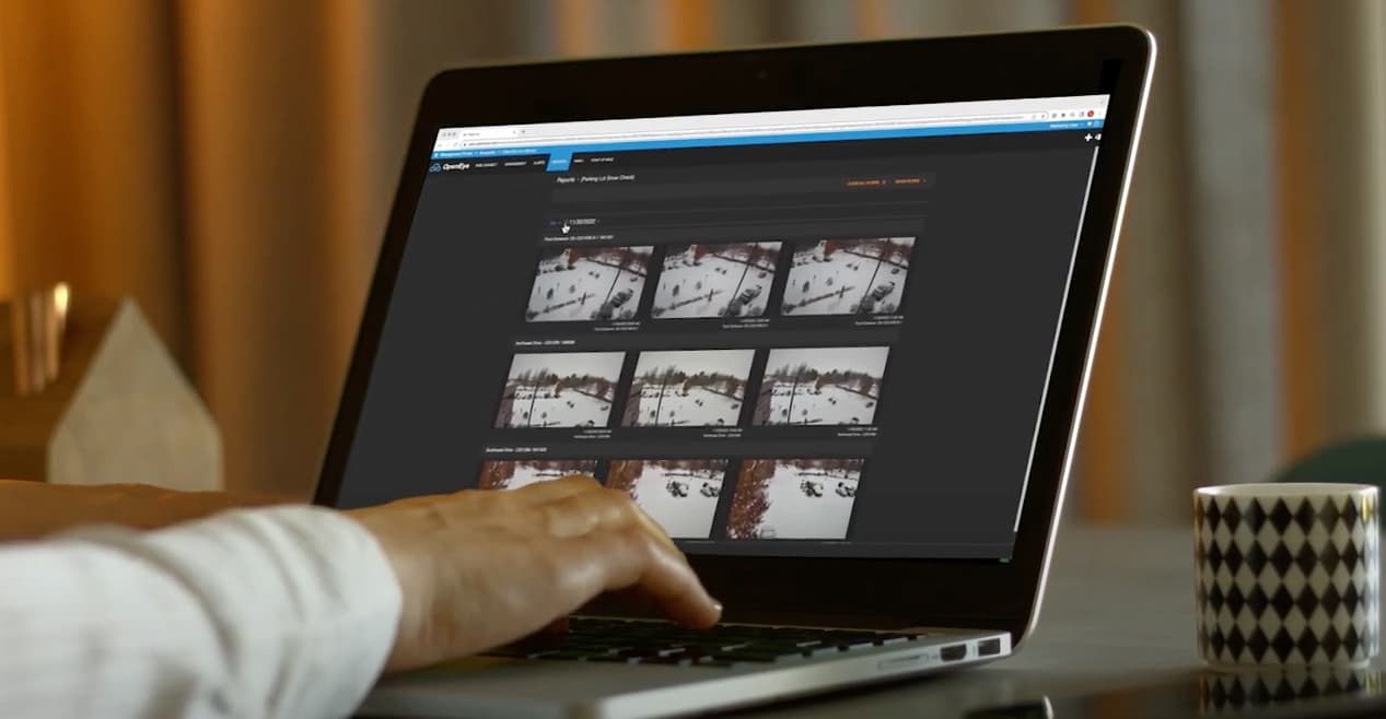 Hands type on a computer which displays OpenEye Web Services.