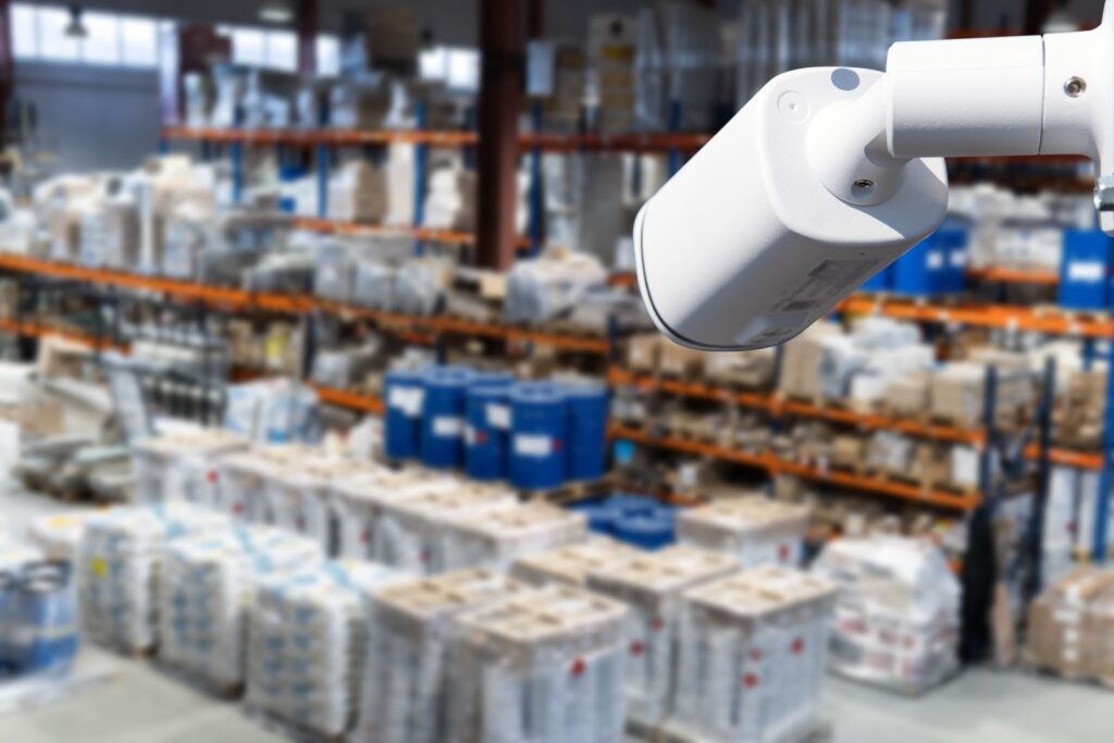A security camera overlooks the interior of a warehouse