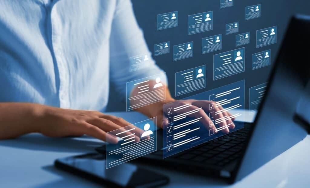 A woman typing on her laptop.