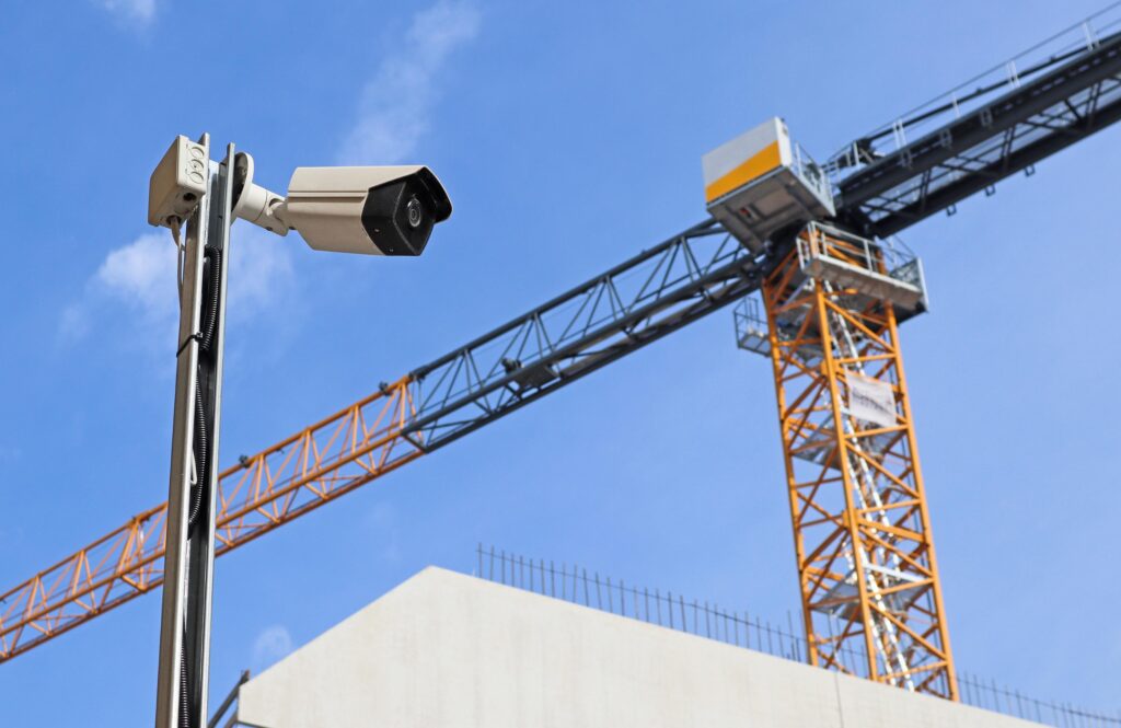 Exterior view of a building featuring a pole holding two security cameras