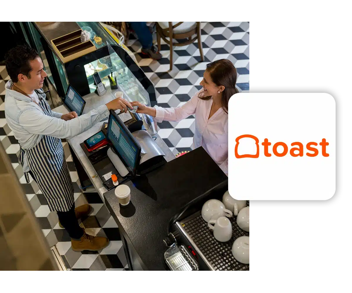 View of a cafe employee assisting a customer at a cash register