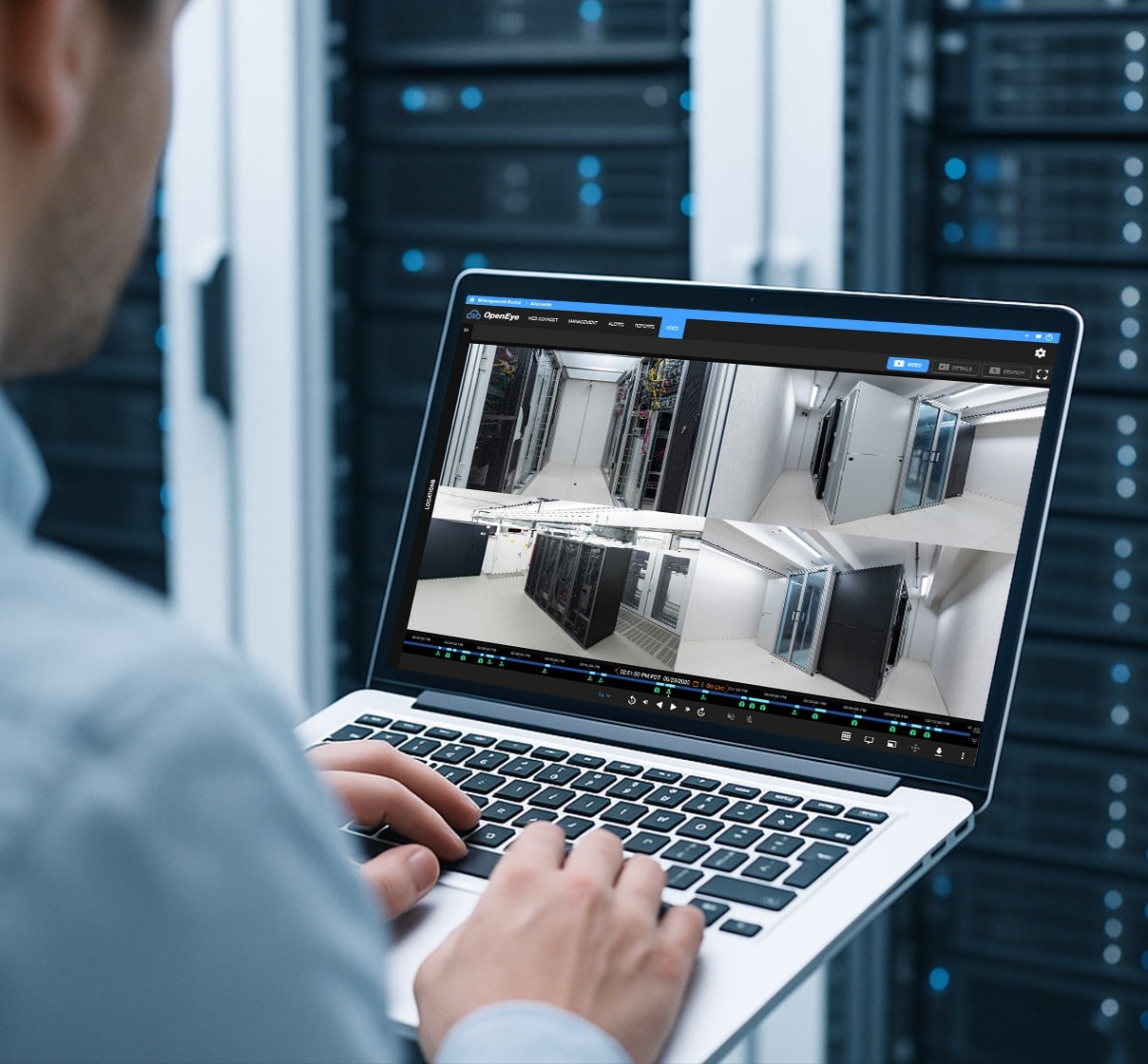 A man reviews footage within OpenEye Web Services on a laptop