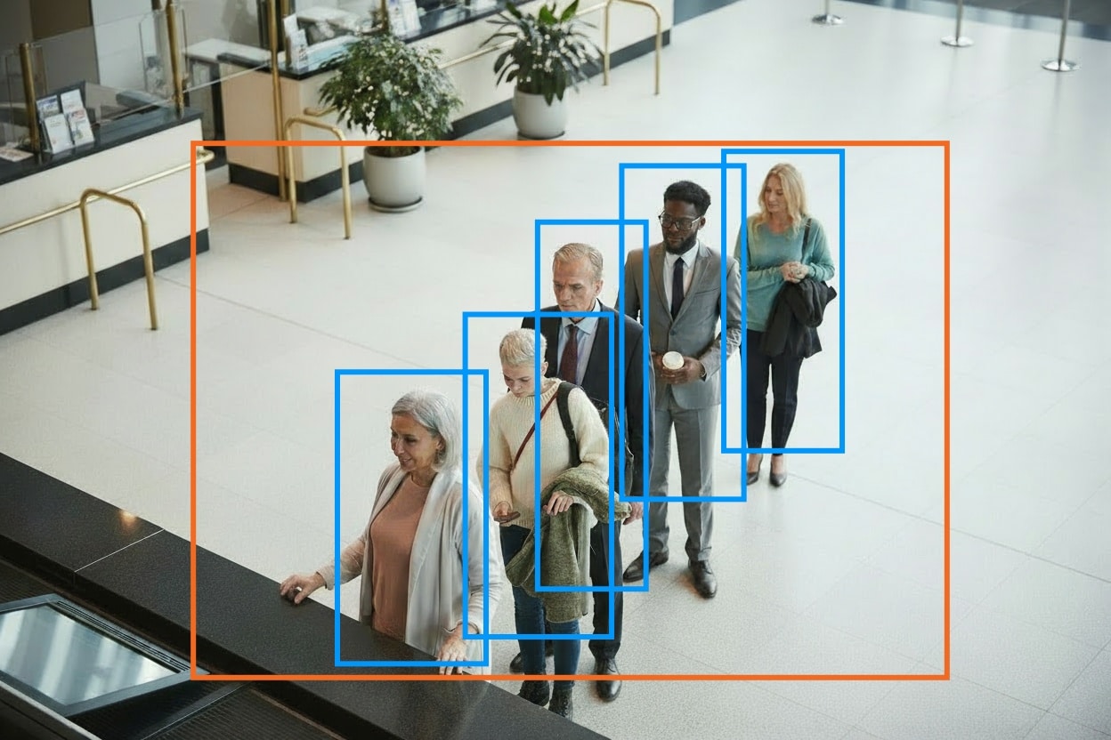 Individuals wait in line in a bank lobby