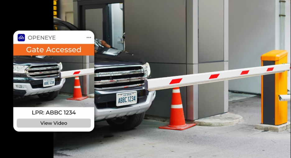 Car sits behind gate in parking garage, with OpenEye Web Services alert on screen that reads, "OPENEYE. Gate Accessed. LPR: ABBC 1234. View Video."