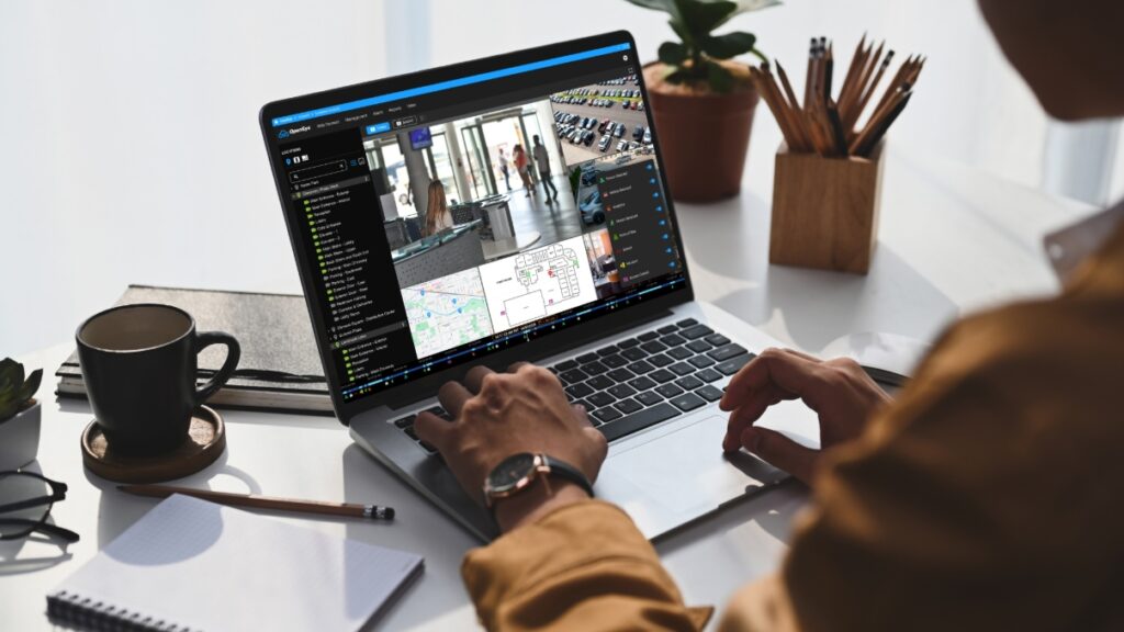 Person with computer displaying OpenEye Web Services in front of them.